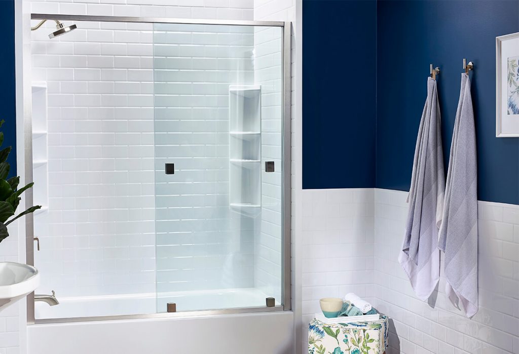 White and blue bathroom with turkish towels hanging from hooks