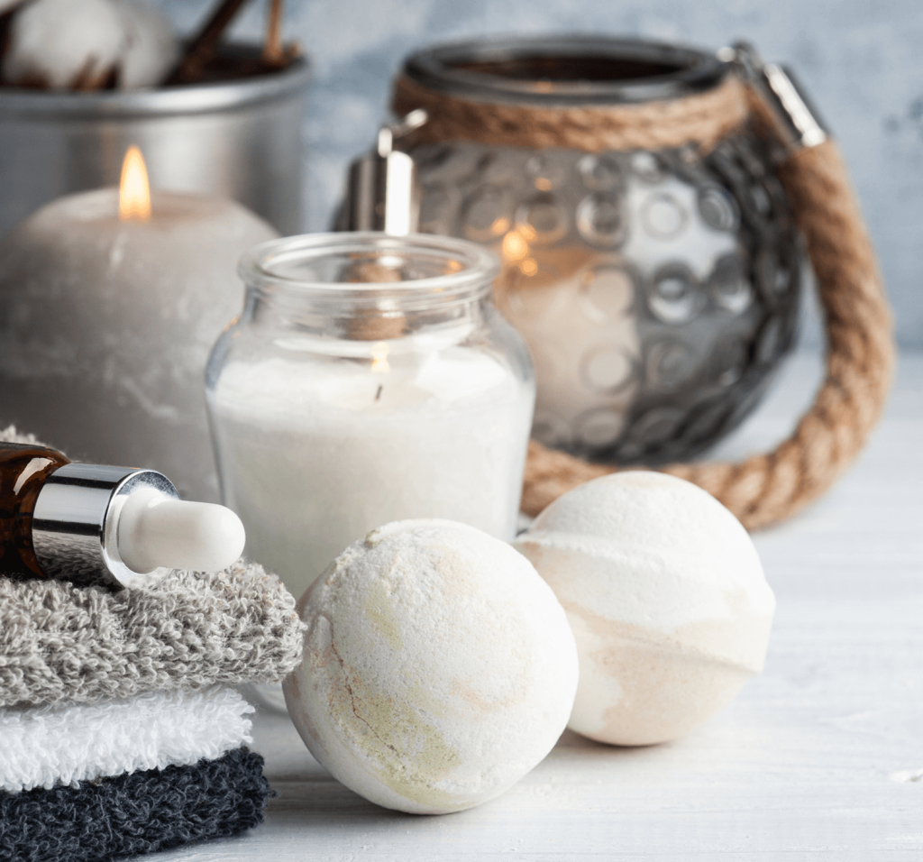 candles, face cloths and bath bombs placed together