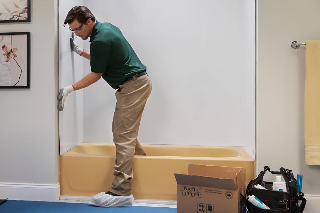 Installer installing seamless acrylic walls