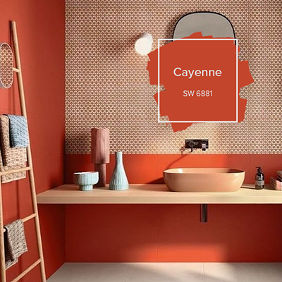 A burnt orange colored bathroom with a clay sink and a rounded mirror