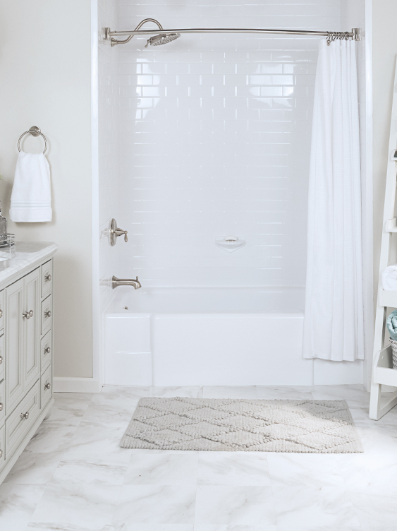 Small bathroom with a white Bath Fitter bathtub and wall solution.
