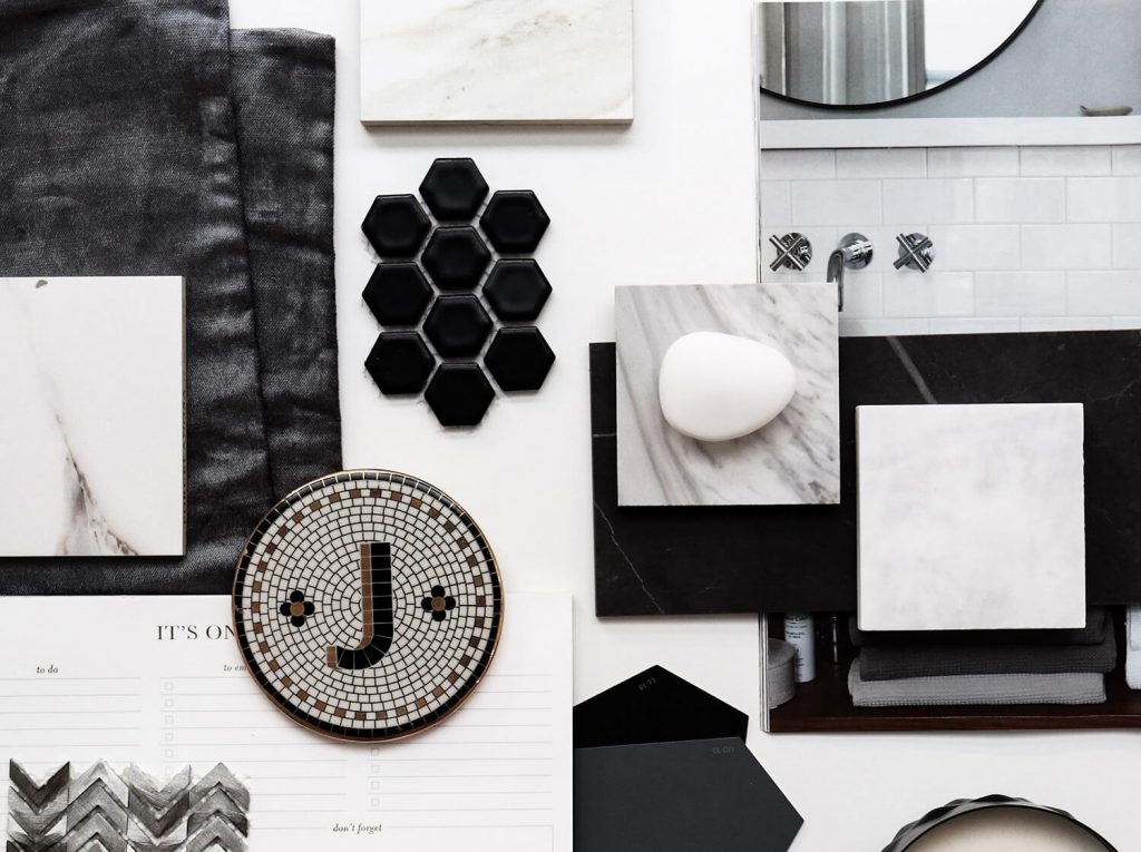 Imageboard of black and white bathroom elements including tile and other accents